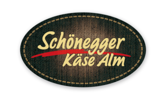 A logo of the Schönegger Käse Alm. It features a nostalgic font on a textured background. | © Schönegger Käse Alm Logo