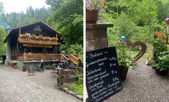 A cozy wooden house surrounded by trees and flowers. In front of the house, there is a sign with food and prices. | © Waldhaus | Yvonne Grosse